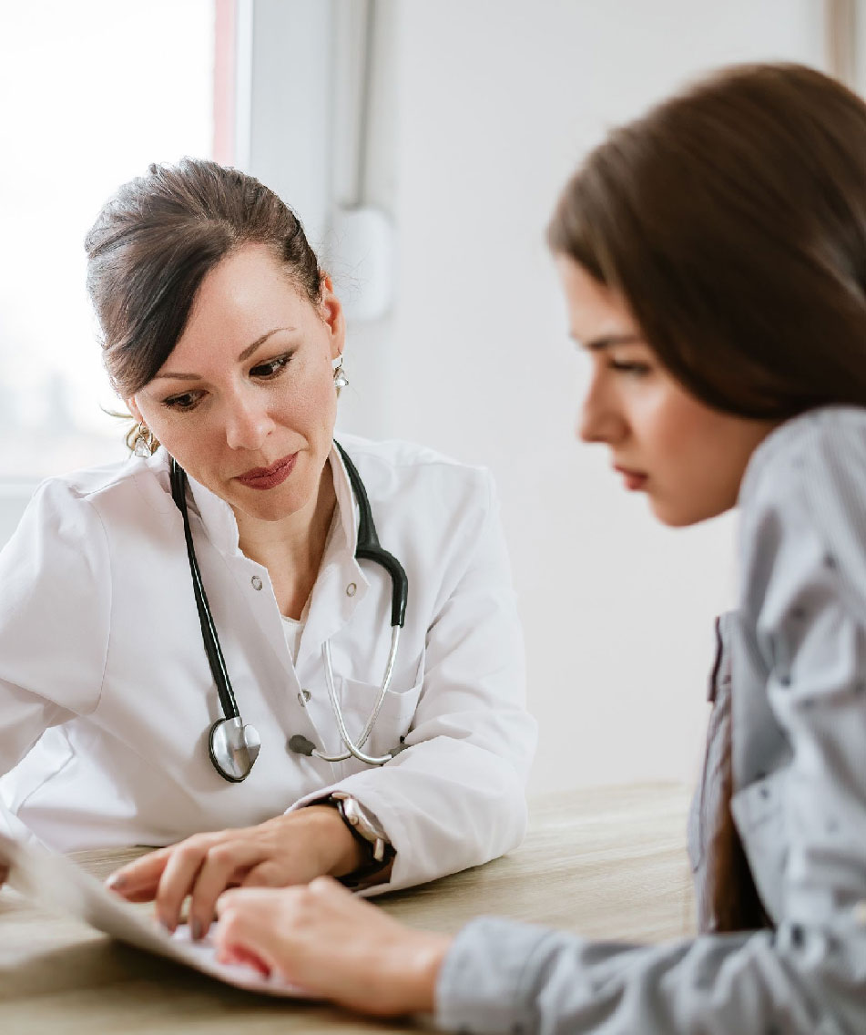 Doctor Showing Reports To Patient