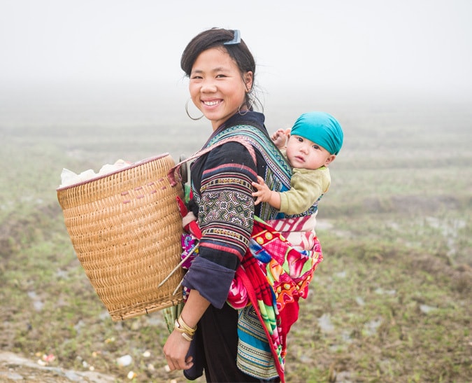 Mother Carrying Baby on Her Back